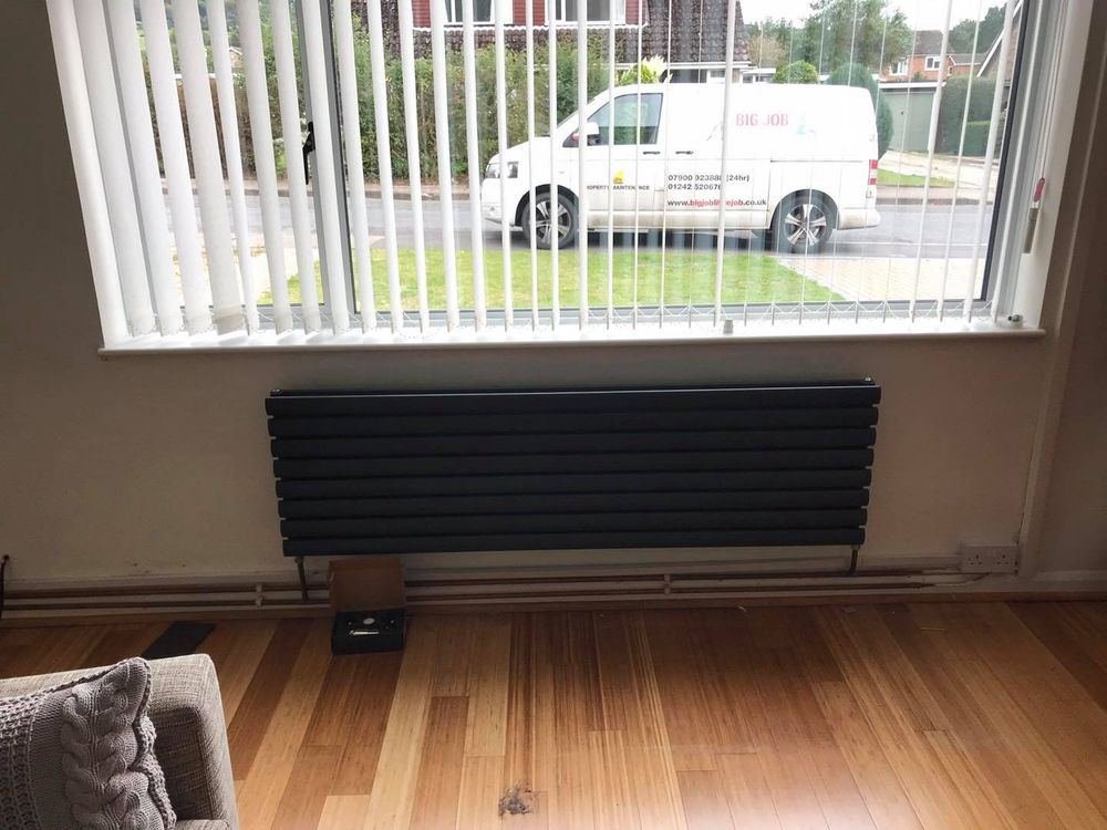 New radiator fitted under a window